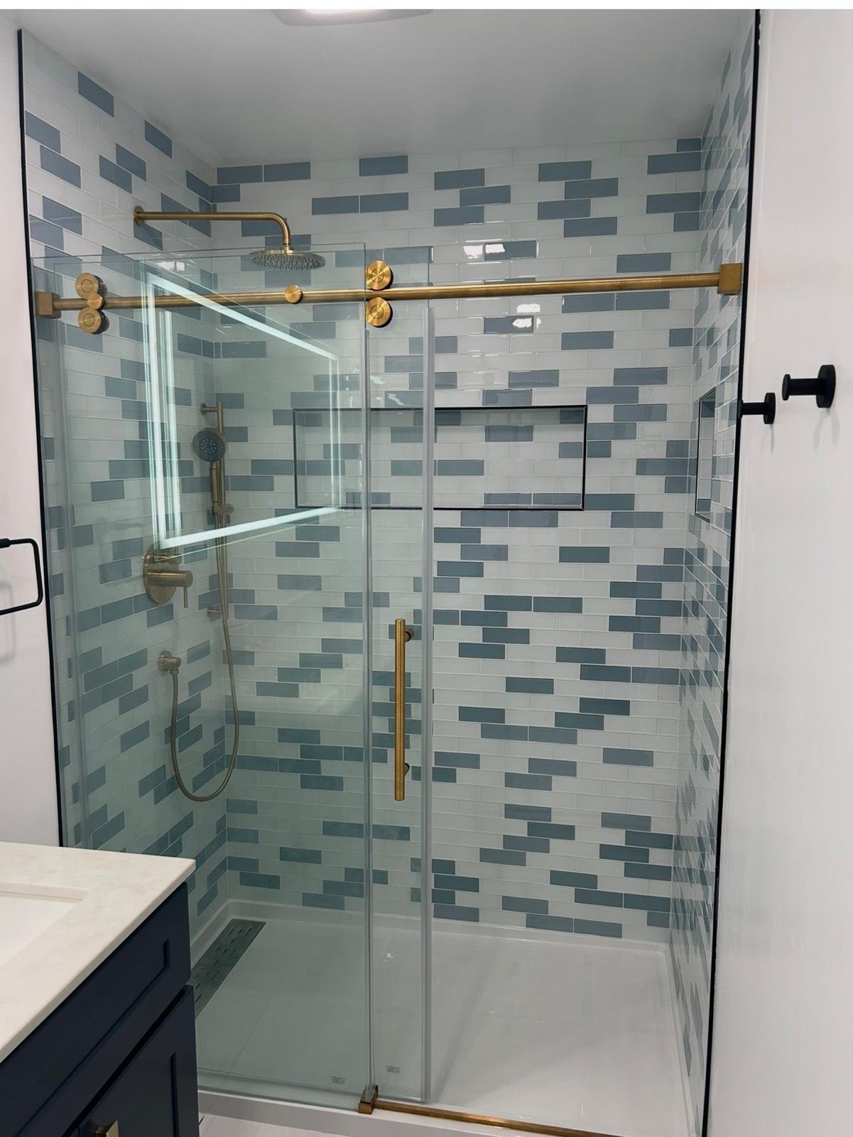 Bathroom Remodels — Custom Tile, Glass & Walnut Vanities — California · photo 1 of 3 · JMG Construction Lic #1007864